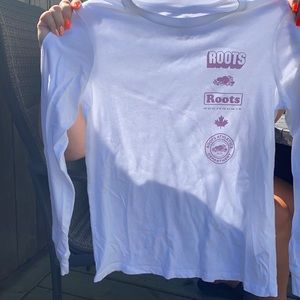 white, purple writing long sleeve shirt from roots